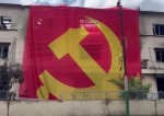 एमाले कार्यकर्ताद्वारा जलेको भवनमा कम्युनिस्ट झण्डा फरफराउने घटना, चर्चा चुलियो